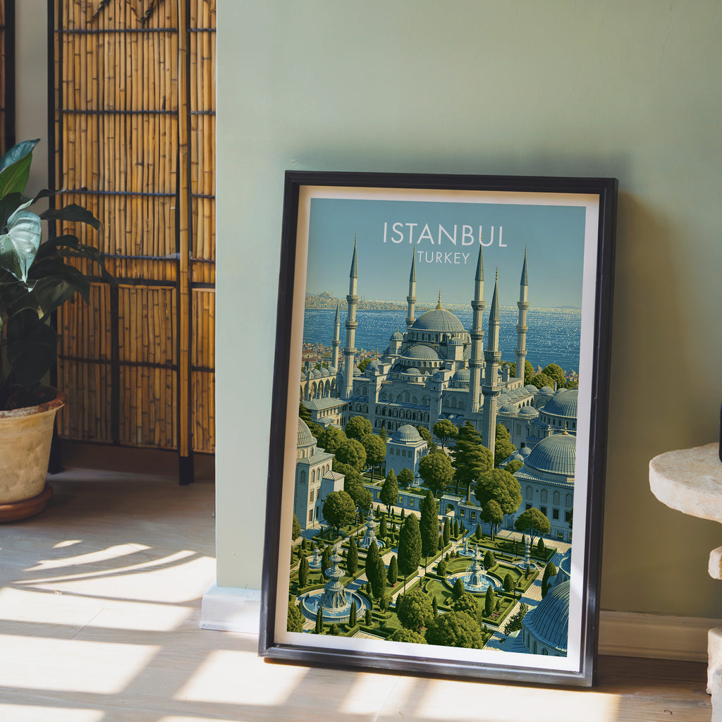 Blue Mosque Istanbul Turkey wall art in a black frame leaning against a sage green wall beside a bamboo screen