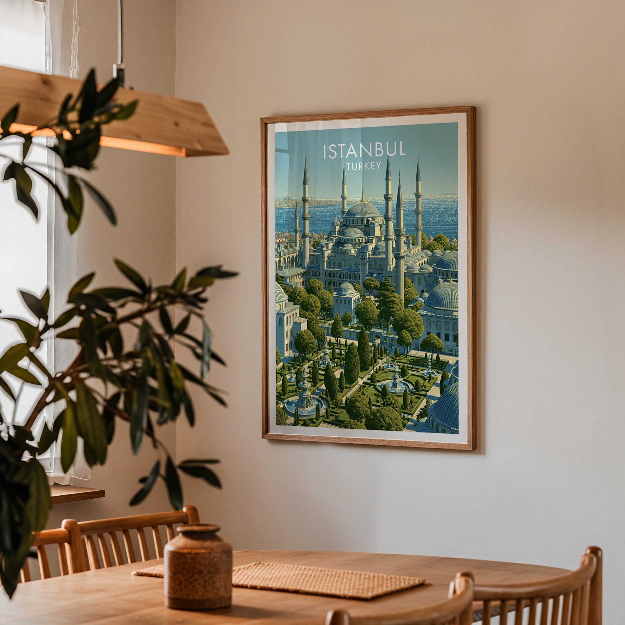 Framed Blue Mosque Istanbul Turkey print on a dining room wall above an oak table in warm afternoon light