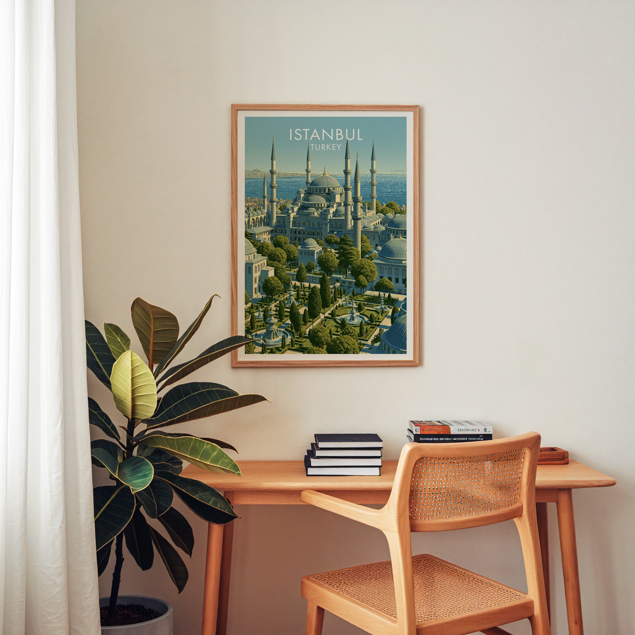 Blue Mosque Istanbul Turkey wall art above a wooden home office desk with a rattan chair and books