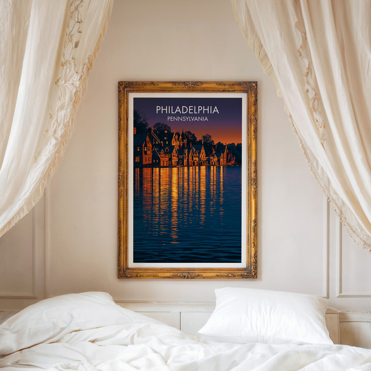 Schuylkill River boathouses print in a carved gold frame over a white bed with linen canopy drapes