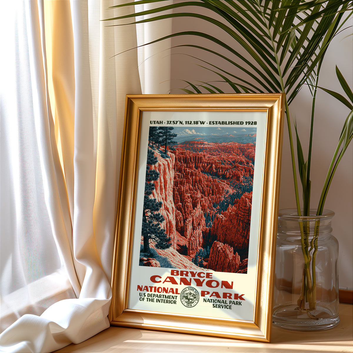Bryce Canyon National Park vintage poster in a gold frame beside a linen curtain and potted palm