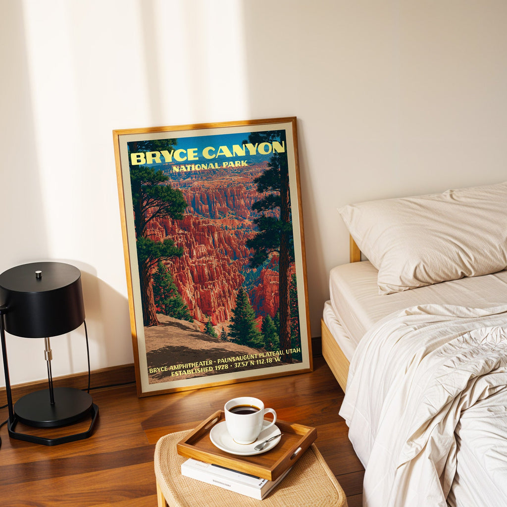 Bryce Amphitheater Bryce Canyon poster in a gold frame on the floor beside a bed and a black lamp