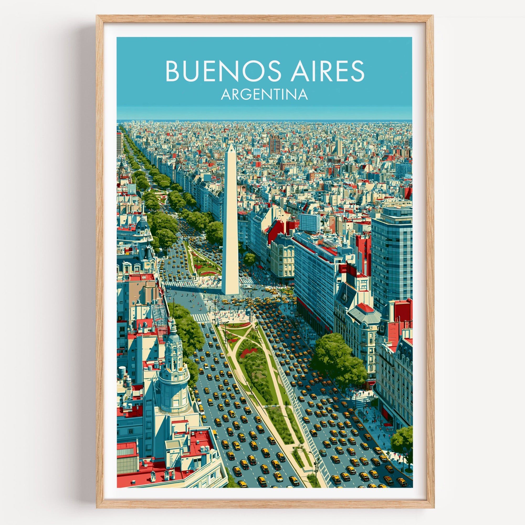 Buenos Aires travel poster in a light oak frame on a plain white wall