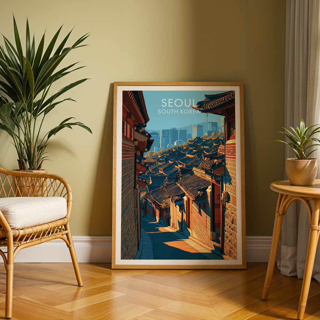 Large Bukchon Hanok Village Seoul travel print in an oak frame leaning on a herringbone floor next to a rattan chair