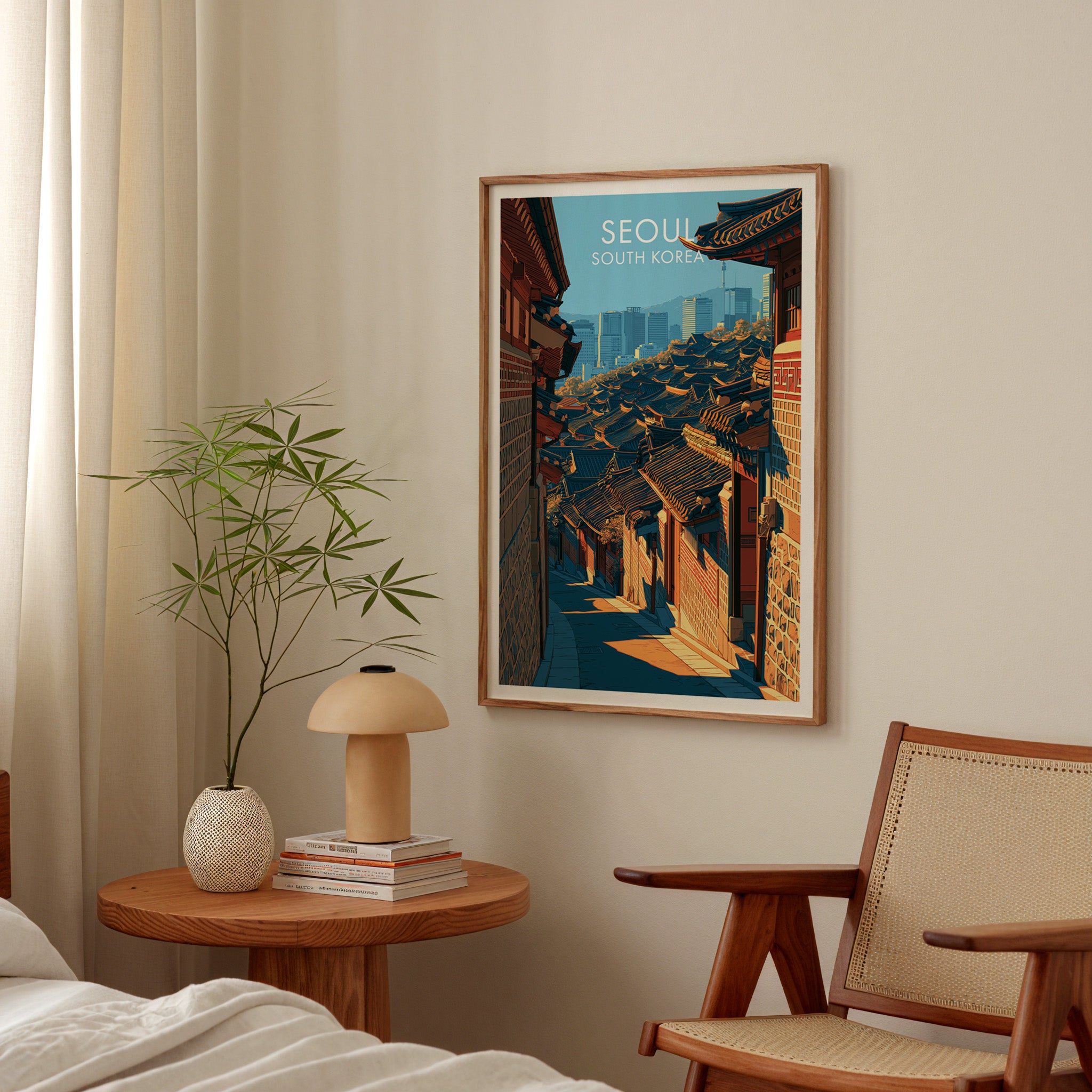 Bukchon Hanok Village Seoul poster above a bedroom nightstand with a bamboo plant and mushroom lamp