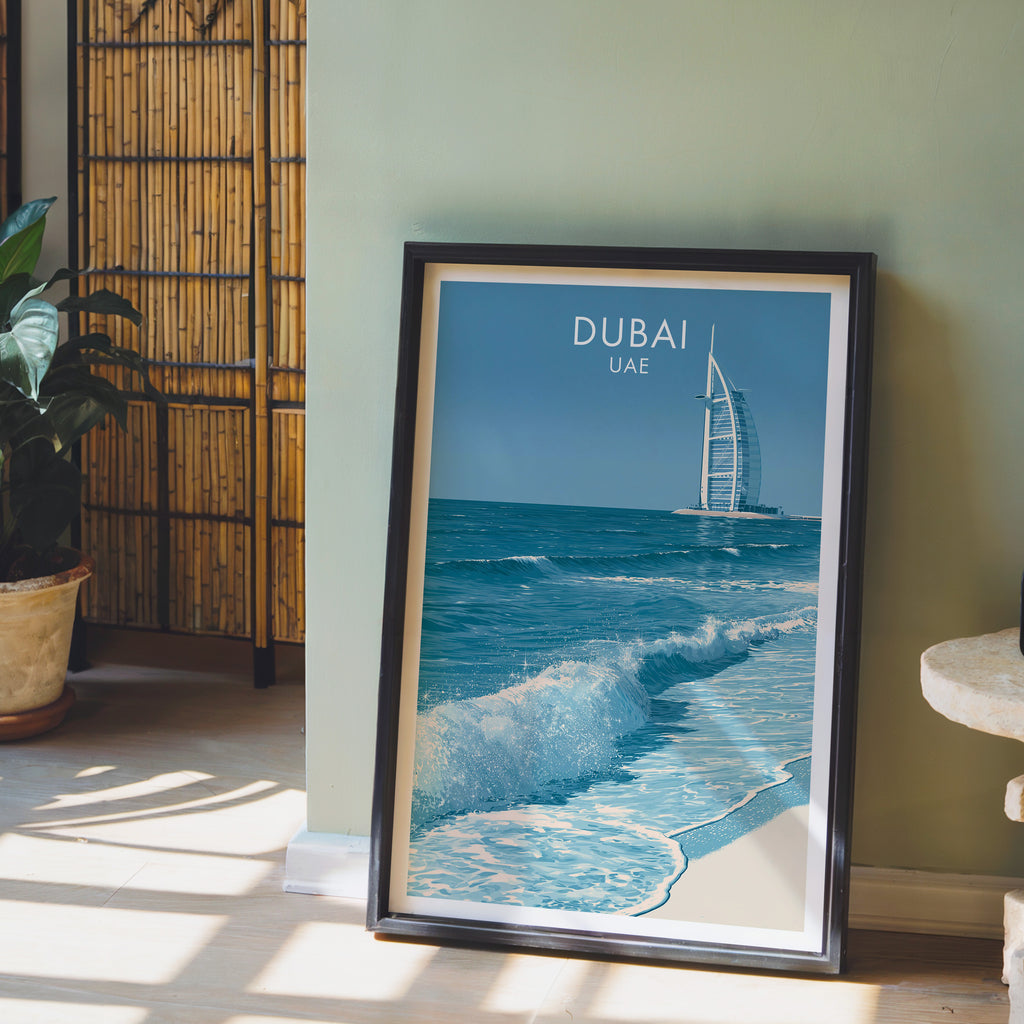 Burj Al Arab Dubai UAE wall art in a black frame leaning against a sage green wall beside a bamboo screen