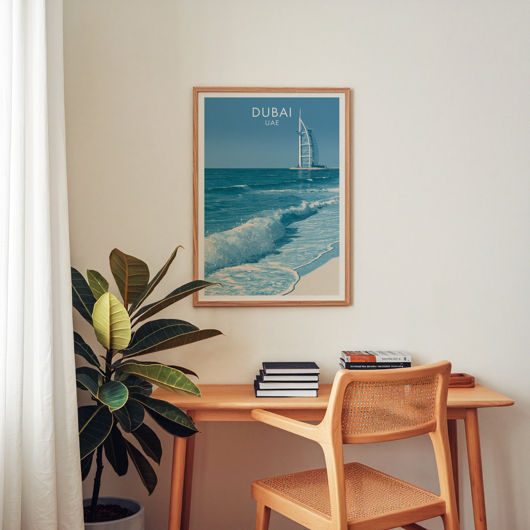 Burj Al Arab Dubai UAE wall art above a wooden home office desk with a rattan chair and books