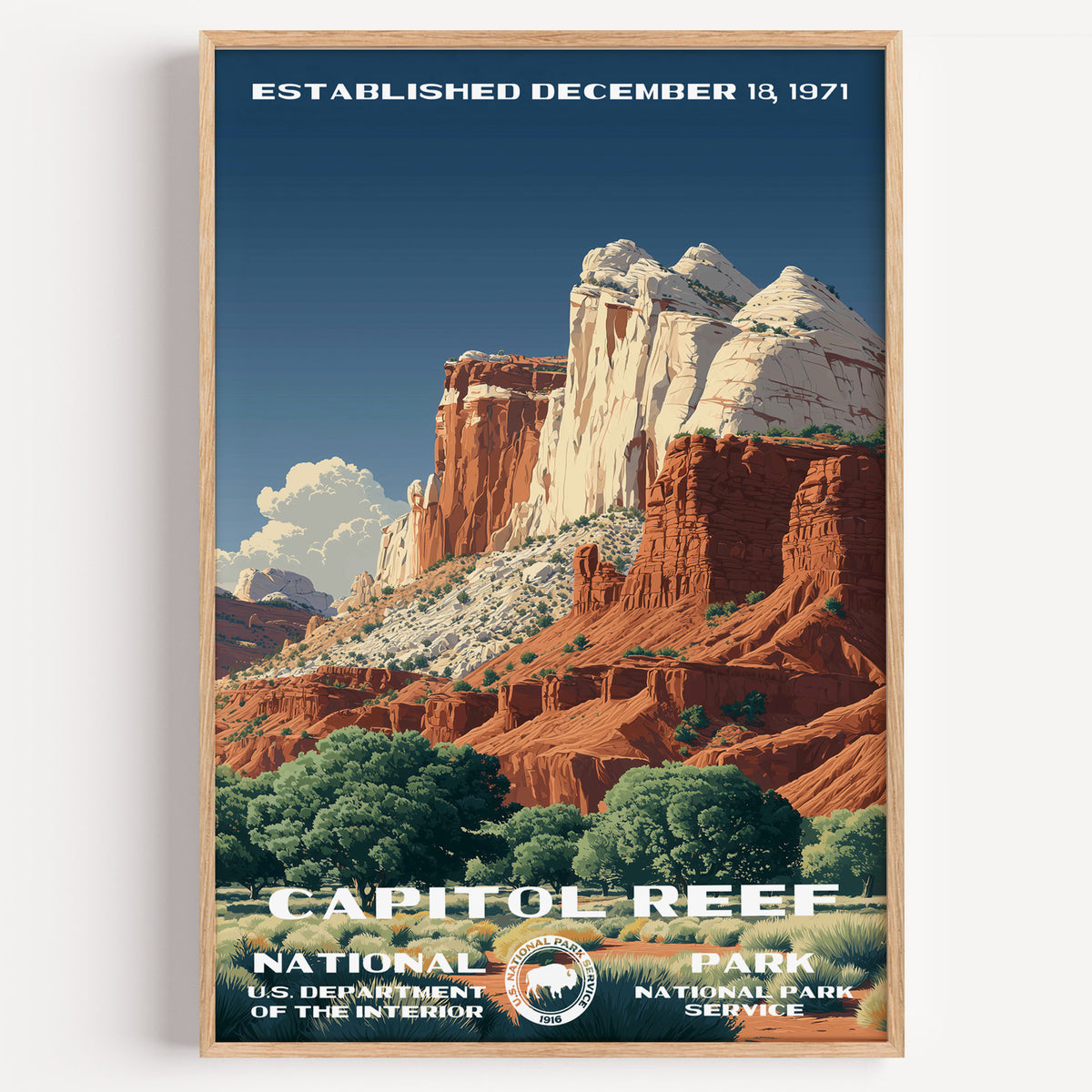 Capitol Reef National Park vintage travel poster in a wood frame, white and red sandstone domes rising above green orchards