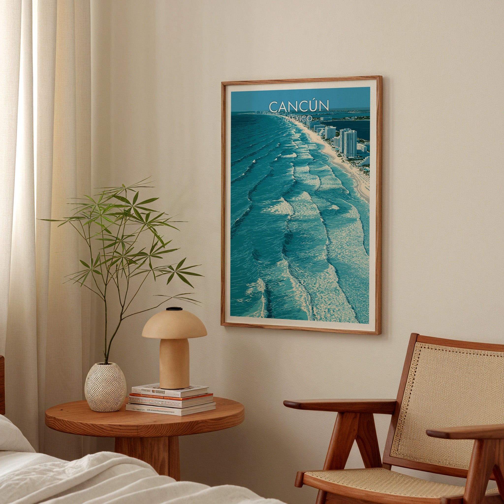 Cancun sea print in an oak frame above a round bedside table with a mushroom lamp and bamboo stems.