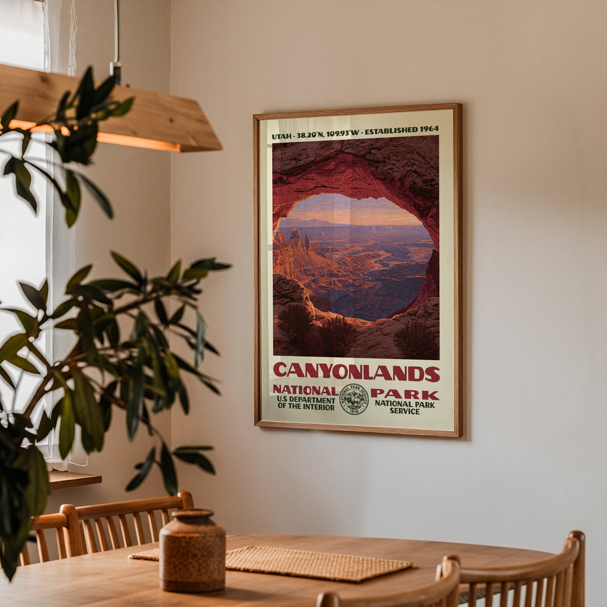 Canyonlands National Park vintage travel print hung above a wooden dining table under a pendant lamp