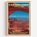 Mesa Arch Canyonlands National Park vintage poster in a light oak frame on a plain white wall
