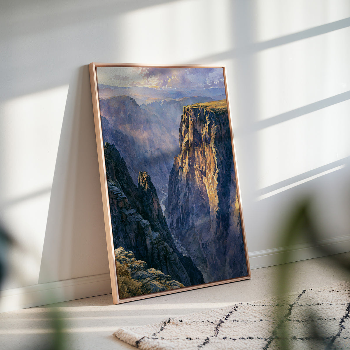 Black Canyon of the Gunnison watercolor framed canvas leaning against a white wall in soft afternoon window light