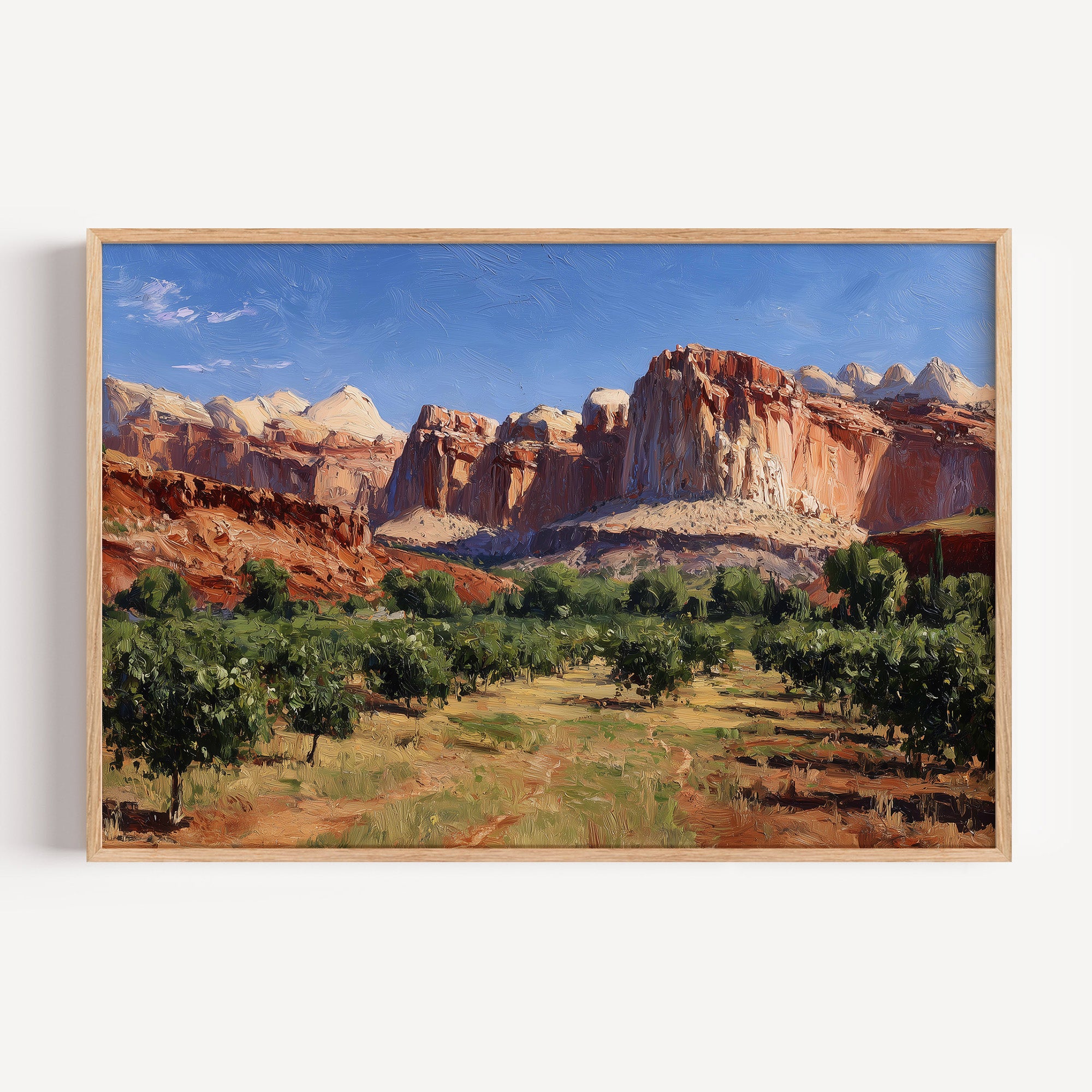 Capitol Reef National Park oil painting print in a light oak frame: red sandstone cliffs above an orchard