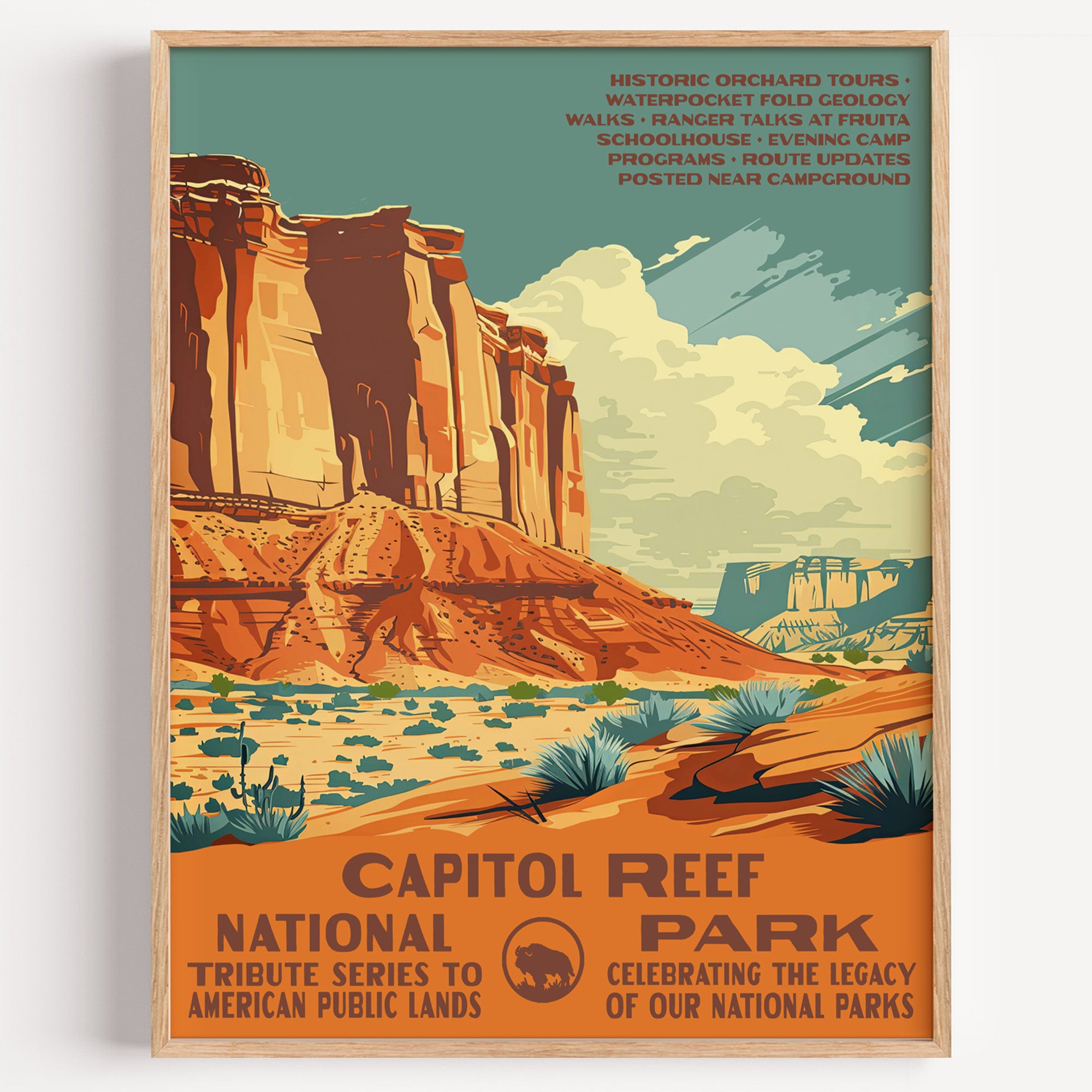 Capitol Reef National Park wall art print in a thin wood frame, layered red and cream sandstone cliffs above desert scrub