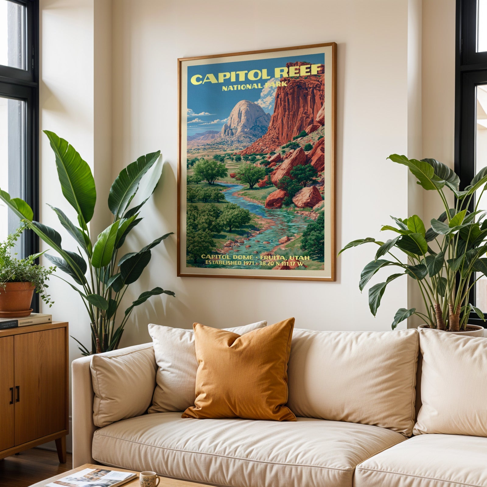 Capitol Reef vintage travel print in oak above a cream sofa with a rust cushion and tall houseplants