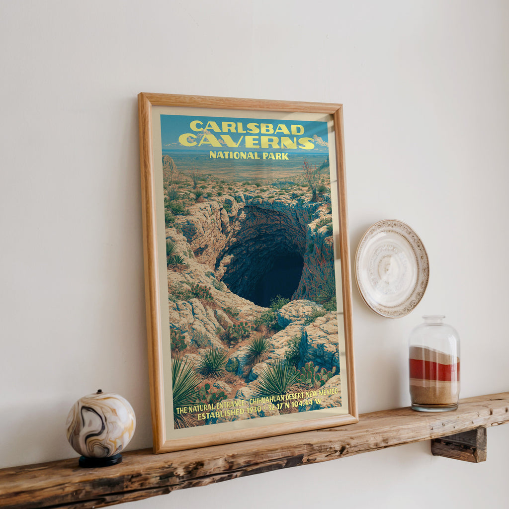 Carlsbad Caverns Natural Entrance print in oak, leaning on a reclaimed wood ledge with a stone sphere and sand jar