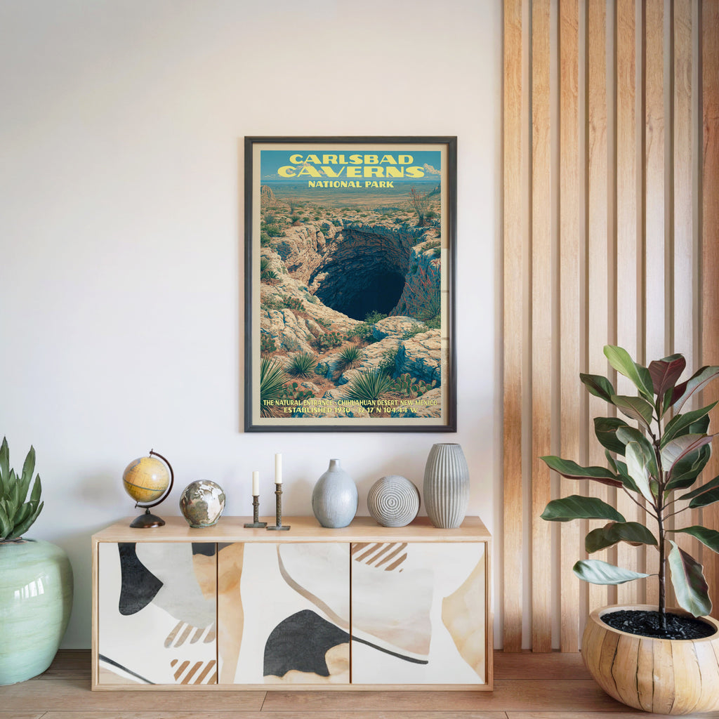 Carlsbad Caverns National Park poster in a black frame above a light wood sideboard by a slatted wall panel