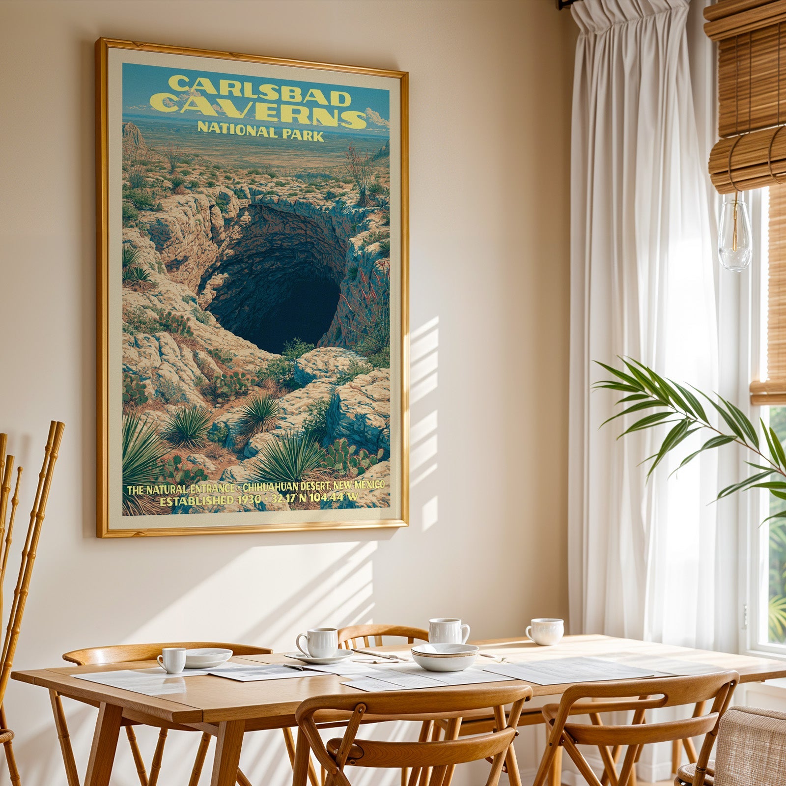 Carlsbad Caverns National Park print in gold above a light oak dining table by a curtained window