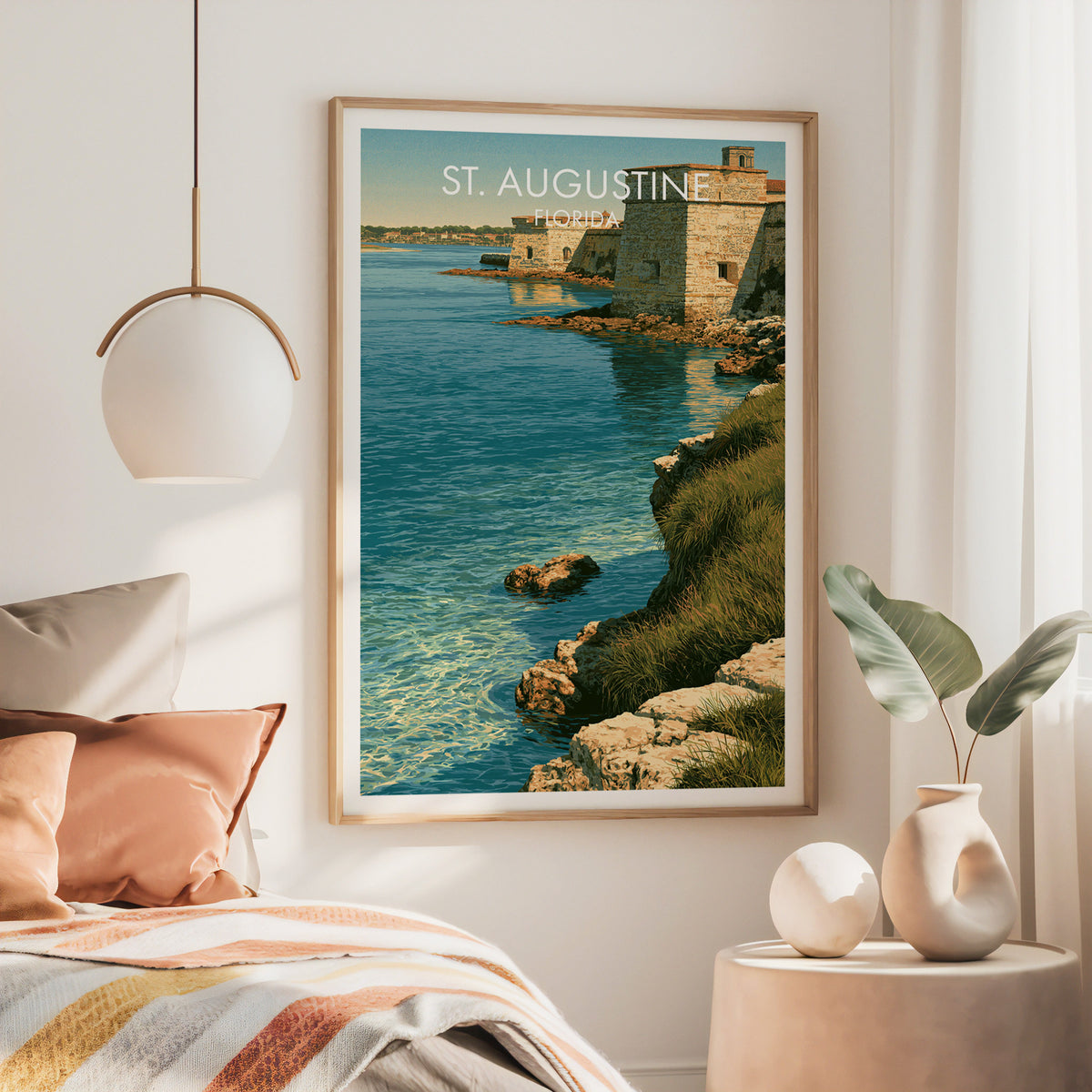Large Castillo de San Marcos canvas in an oak frame above a rust-toned bed with a brass lamp