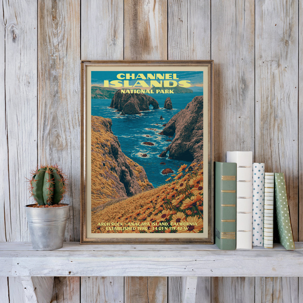Channel Islands vintage poster in a slim gold frame on a whitewashed plank wall beside a cactus and pastel books
