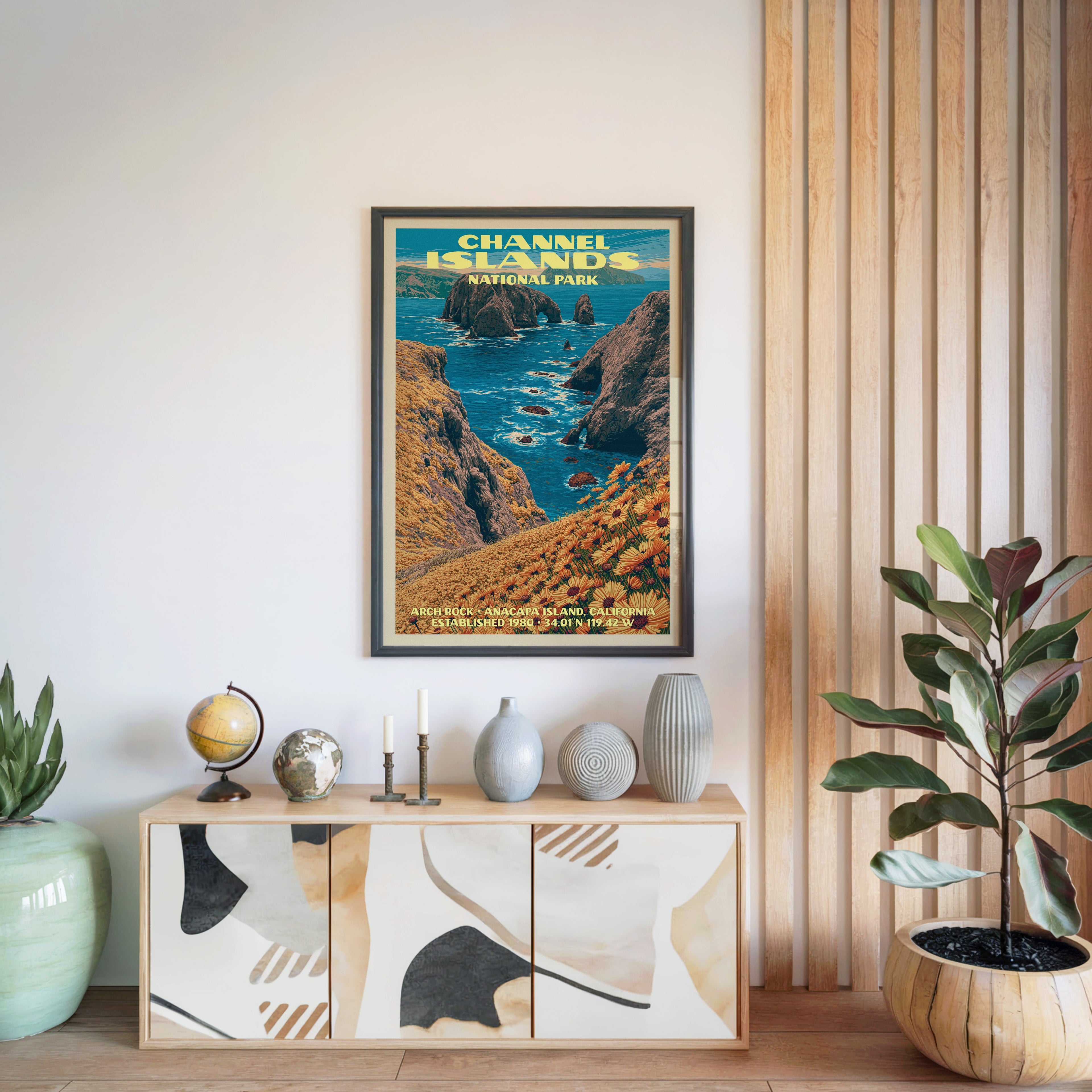 Channel Islands National Park poster in a black frame above a light wood sideboard by a slatted wall panel