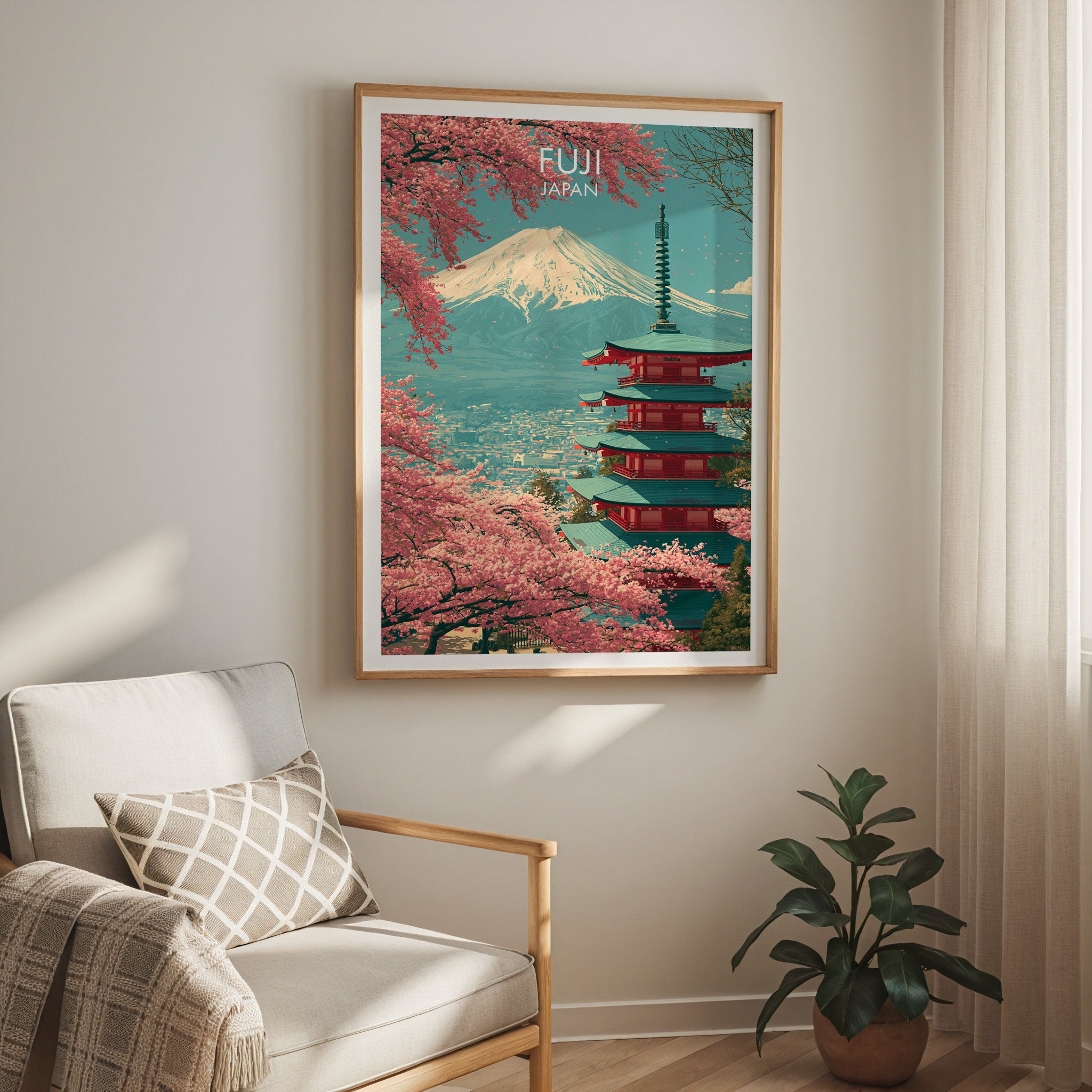 Mount Fuji Japan travel print in a light oak frame on a living room wall beside a linen armchair