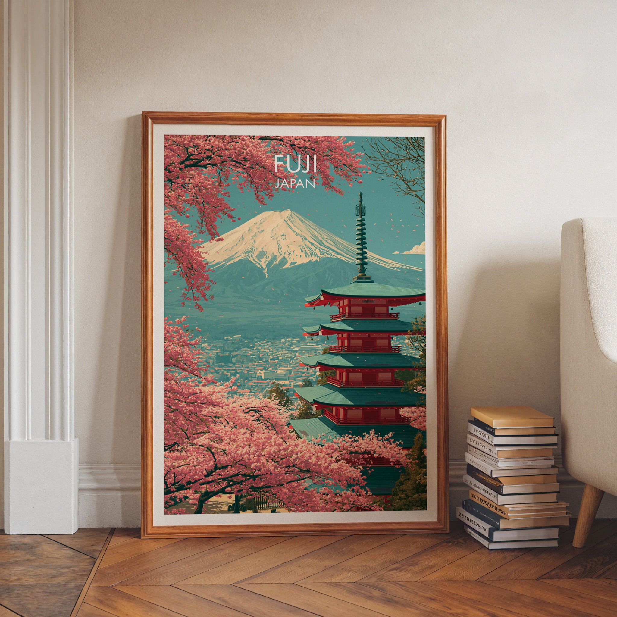 Mount Fuji Japan art print in a walnut frame leaning in a hallway beside stacked books