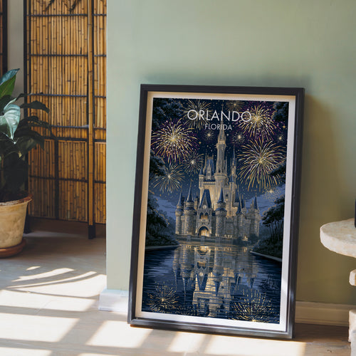 Orlando Florida print in a black frame leaning on a sage green wall beside a bamboo screen and peace lily