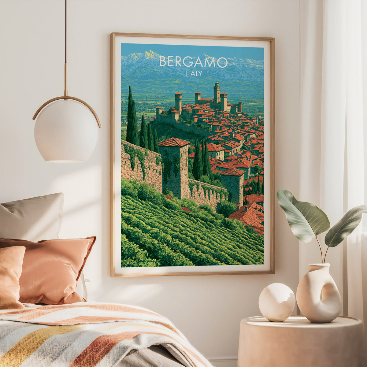 Città Alta wall art, large oak frame above a bed with rust bedding and a brass globe pendant