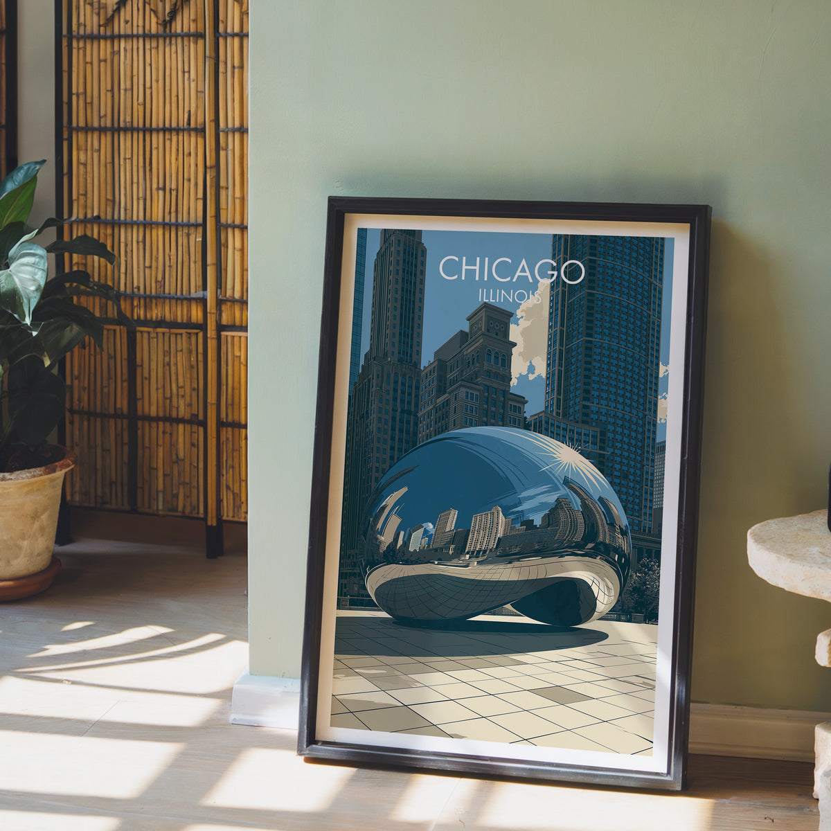 Chicago Bean print in a black frame on a sage wall with a bamboo screen and an orchid in a clay pot.