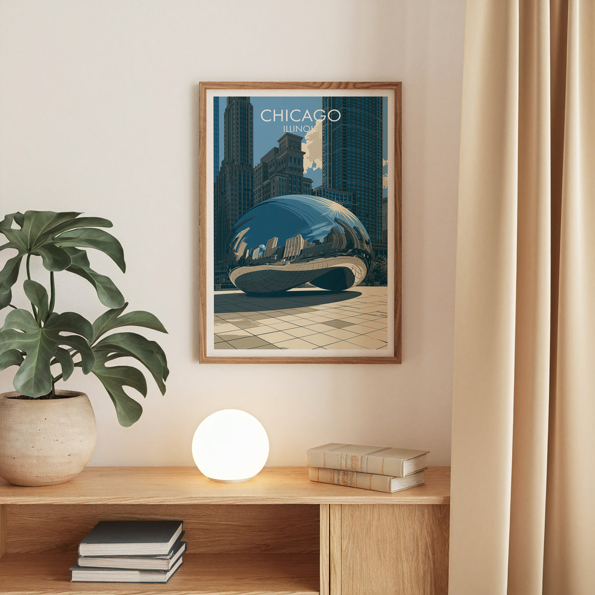 Cloud Gate poster in an oak frame on a beige wall with an oak console, a monstera and a globe lamp.