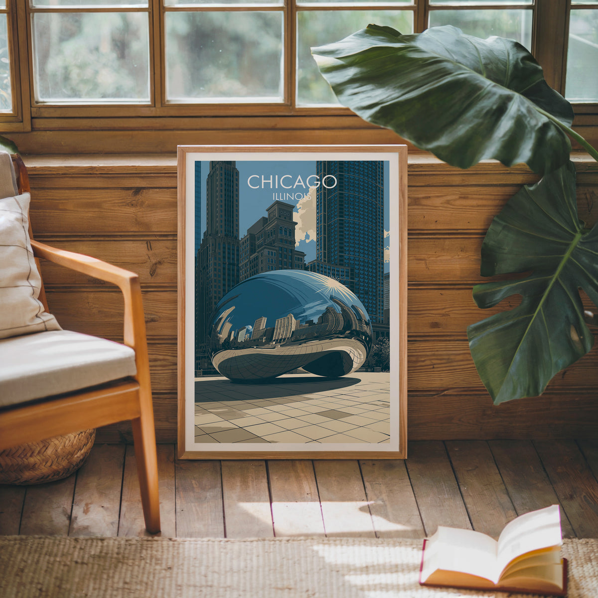 Chicago Bean art print in an oak frame on a sunlit wood-panel wall near monstera and a mid-century chair.