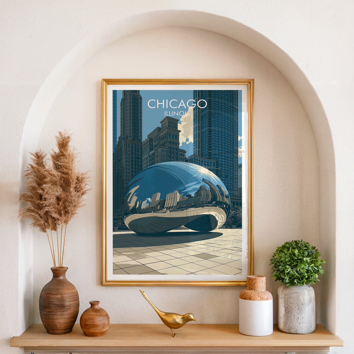 Chicago Bean poster in a gold frame set in an arched alcove with pampas grass and a brass bird.
