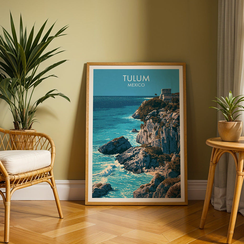 Mexico coastal ruins in an oak frame on herringbone parquet, olive wall, rattan chair and cane table.