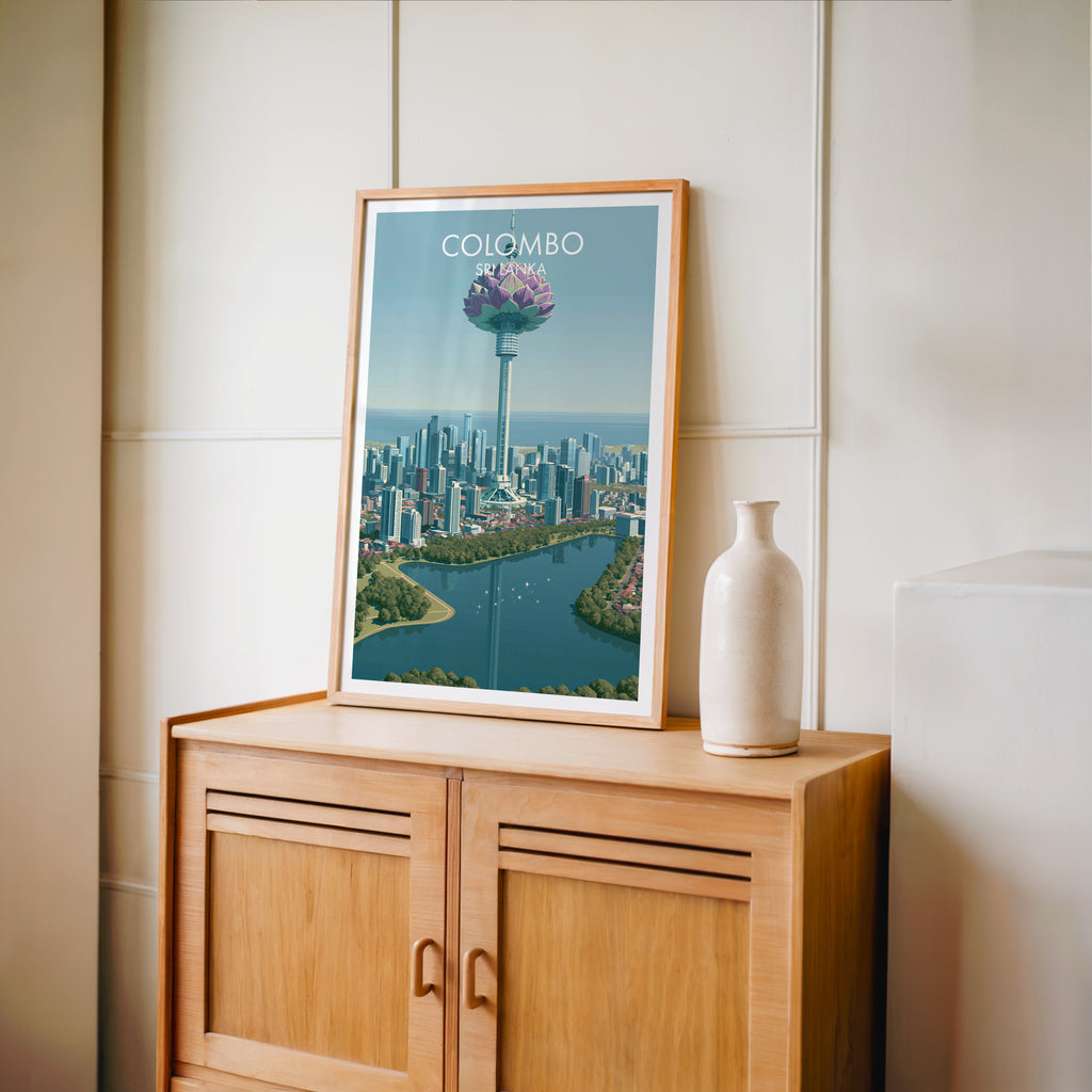 Small Colombo Sri Lanka travel poster in an oak frame on a mid-century sideboard with a ceramic vase