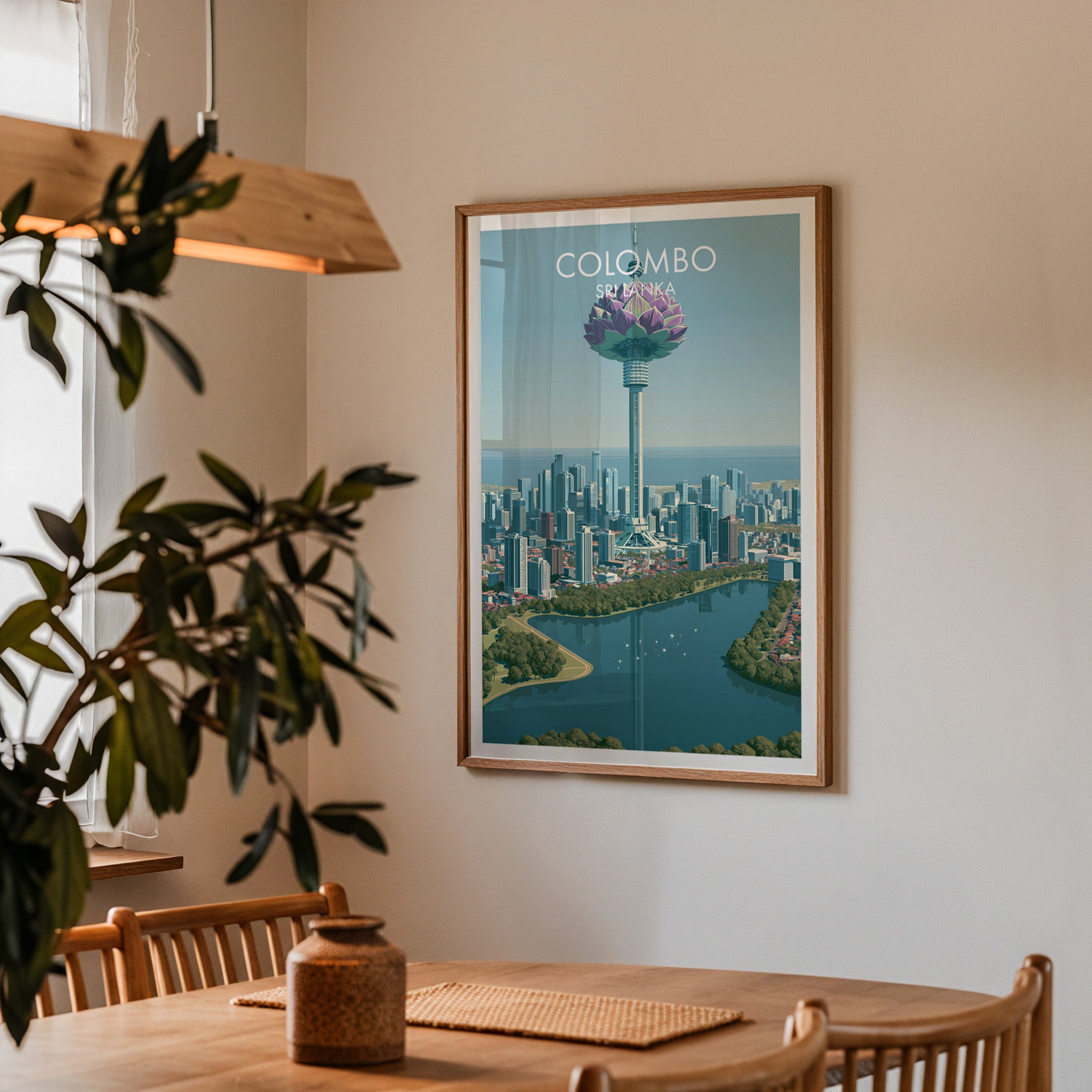 Framed Colombo Sri Lanka print on a dining room wall above an oak table in warm afternoon light
