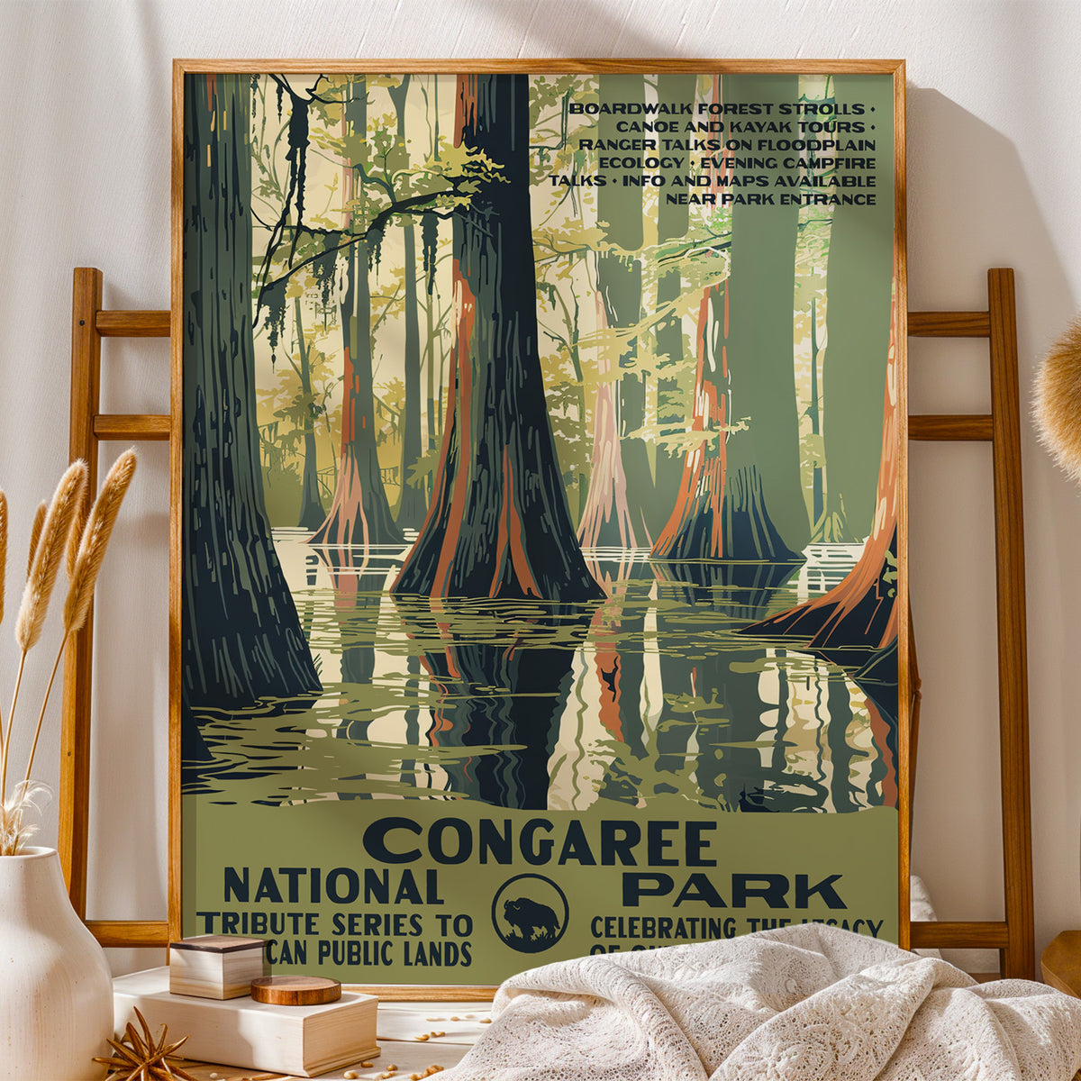 Congaree National Park vintage print on a wooden stand with folded blankets and books