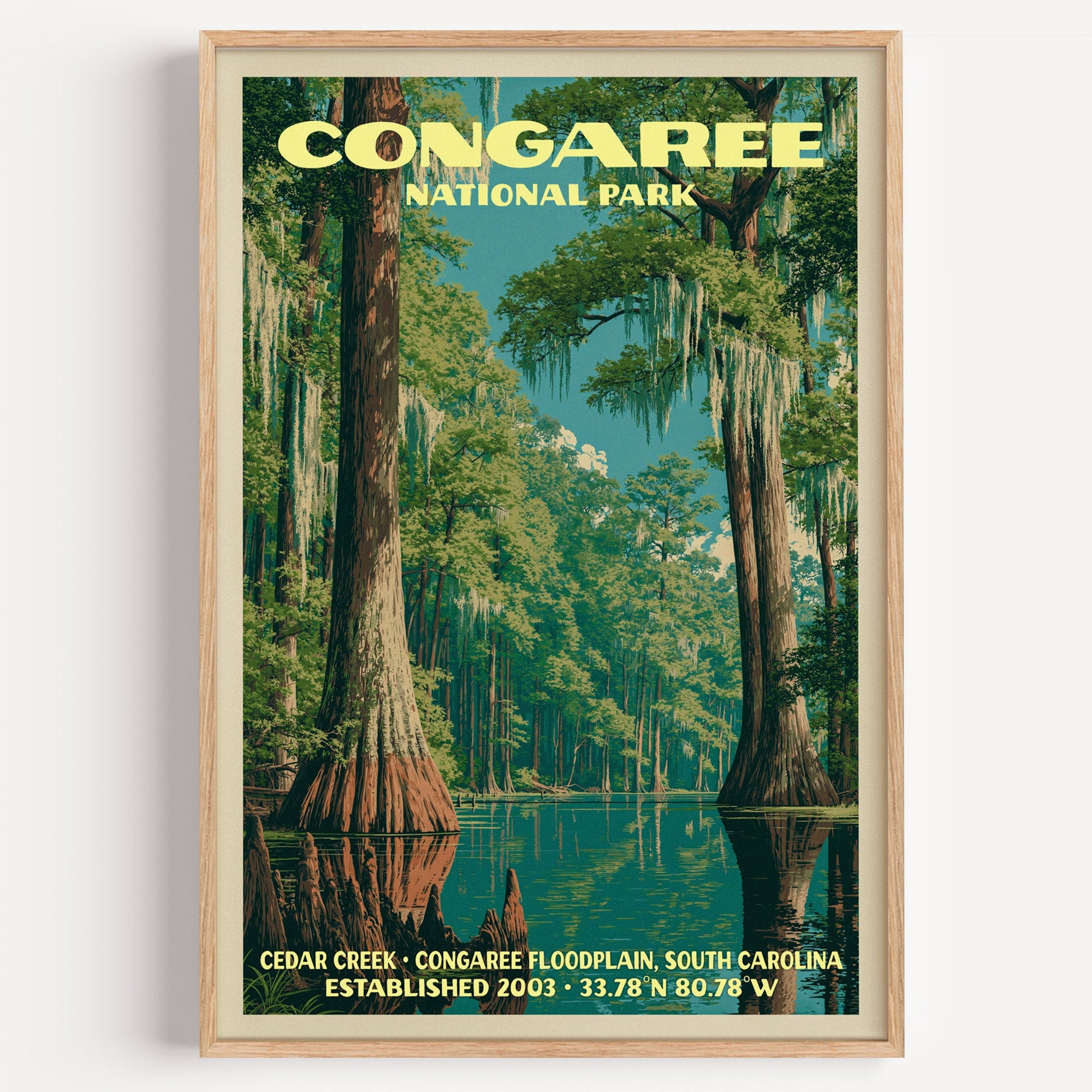 Cedar Creek Congaree National Park vintage poster in a light oak frame on a plain white wall