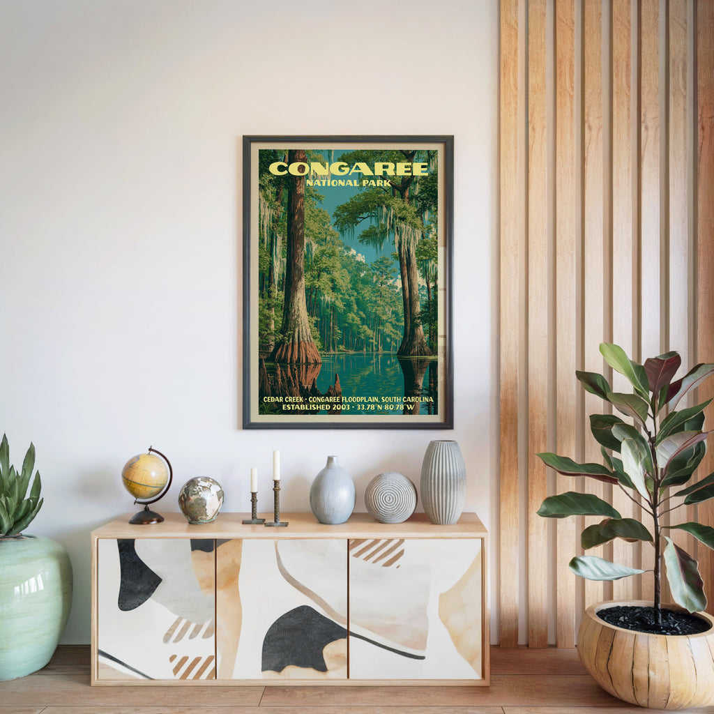 Congaree National Park poster in a black frame above a light wood sideboard by a slatted wall panel