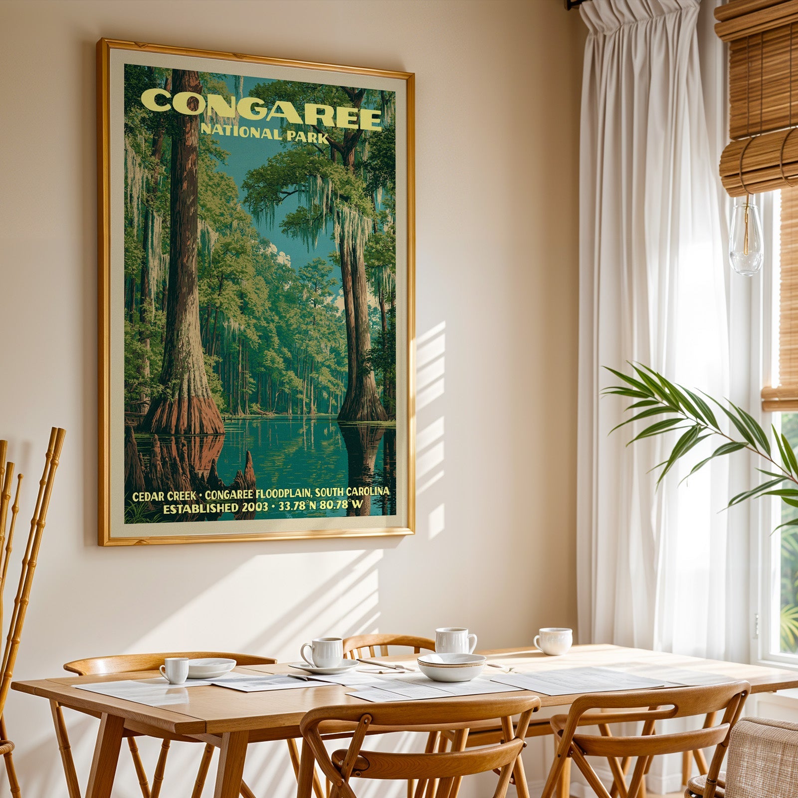 Congaree National Park print in gold above a light oak dining table by a curtained window