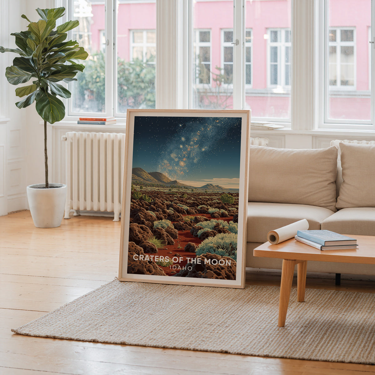 Idaho lava poster in oak on the floor of a room whose window frames a pink building facade.
