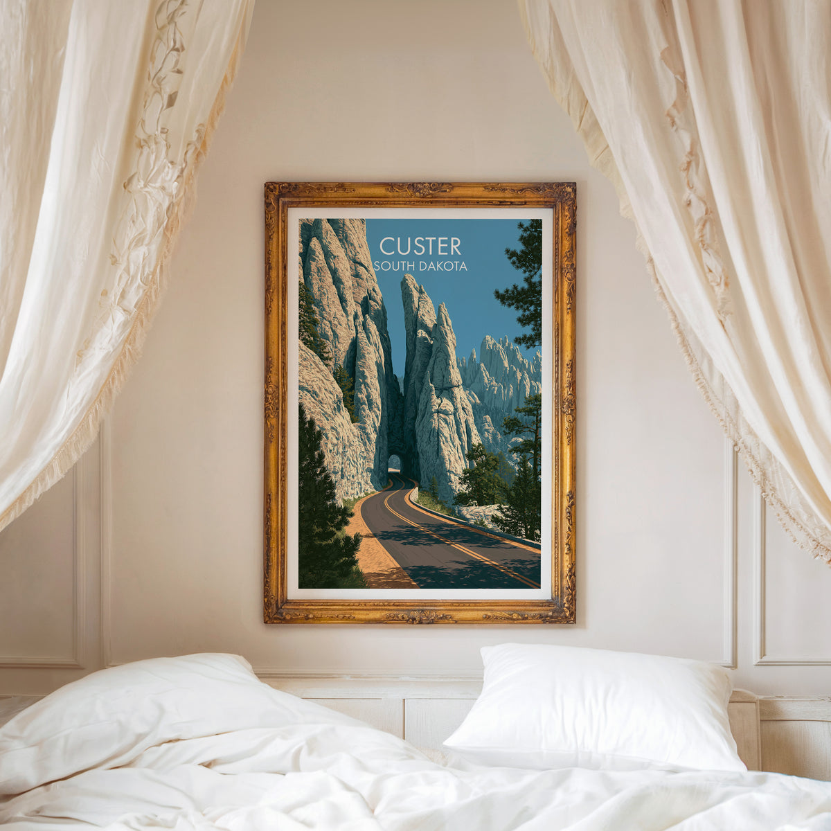 South Dakota road canvas print in a carved gold frame above a white bed with linen canopy drapes.