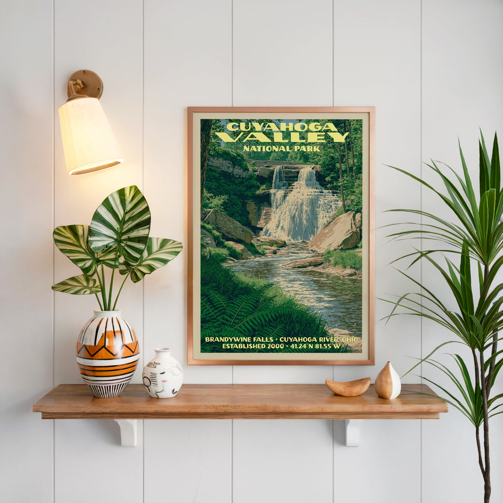 Brandywine Falls Cuyahoga Valley print framed on white panelling above an oak shelf with a patterned vase
