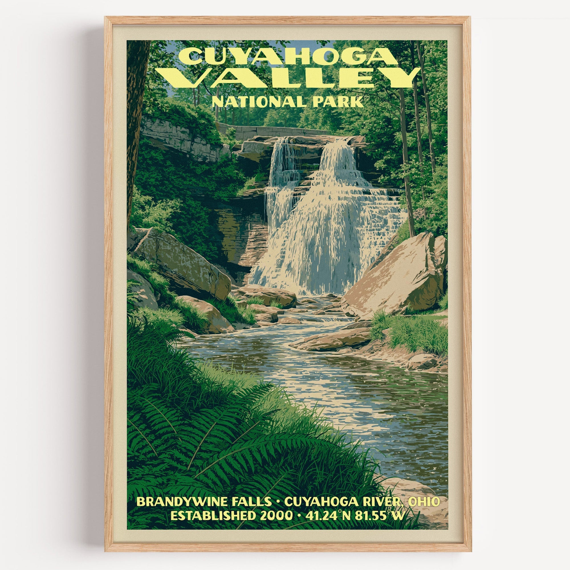 Brandywine Falls Cuyahoga Valley vintage poster in a light oak frame on a plain white wall