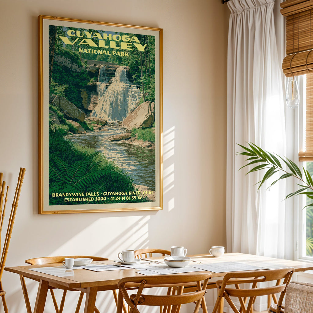 Cuyahoga Valley National Park print in gold above a light oak dining table by a curtained window