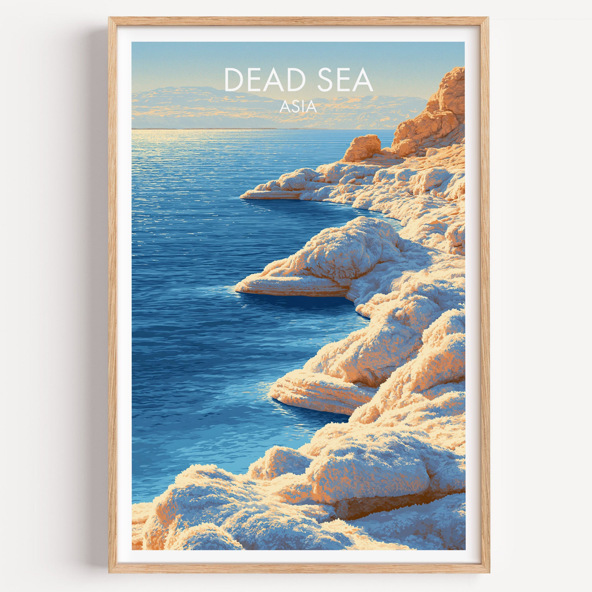 Dead Sea Middle East travel poster in a natural wood frame, shown against a clean white wall
