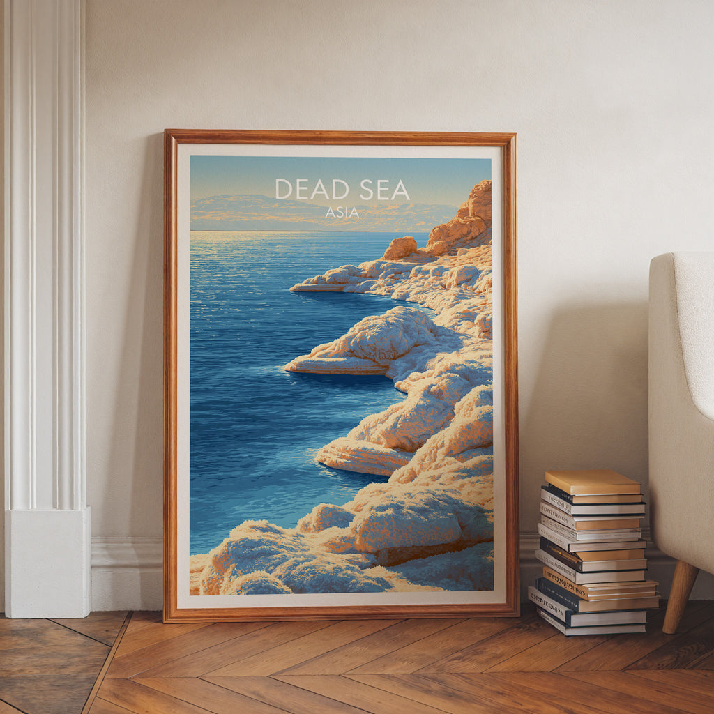 Dead Sea Middle East art print in a walnut frame leaning in a hallway beside stacked books