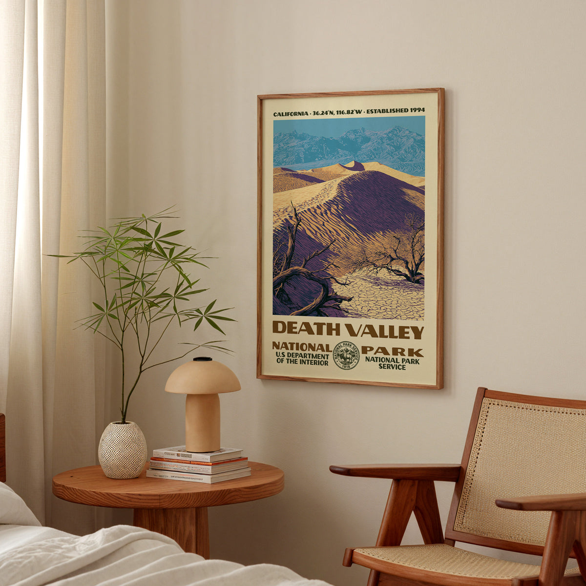 Death Valley National Park vintage WPA print hanging above a side table in a calm bedroom corner