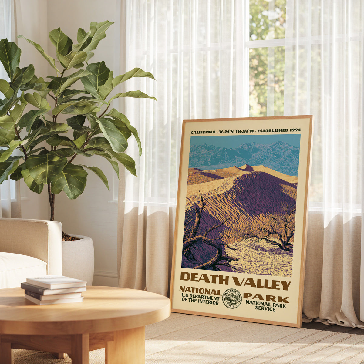 Death Valley National Park retro art print propped on a round wood table by a bright window