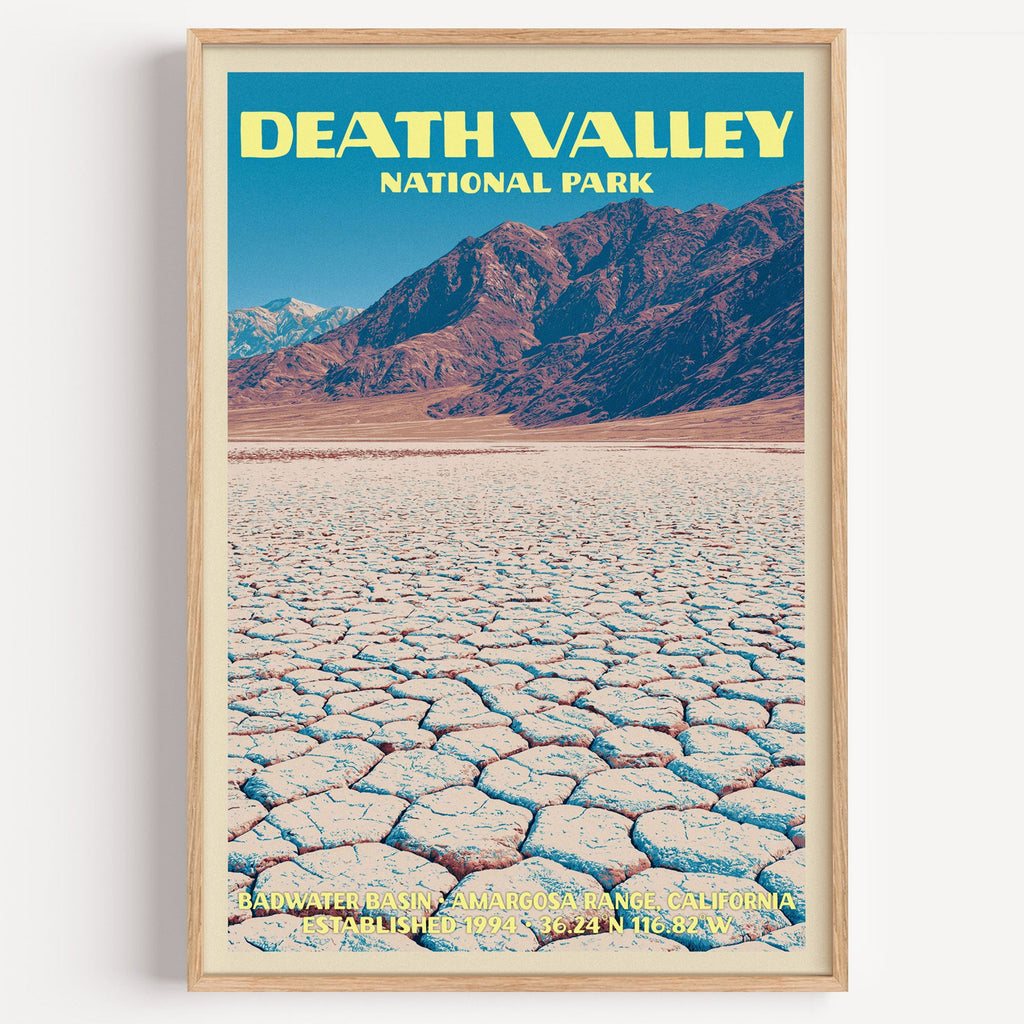 Badwater Basin Death Valley vintage poster in a light oak frame on a plain white wall